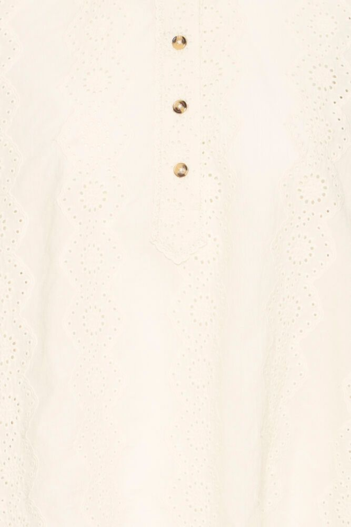 Relaxed cotton shirt by Atelier Rêve in a classic birch shade. Loose fit, long sleeves and easy everyday style. Shop at Dotique.