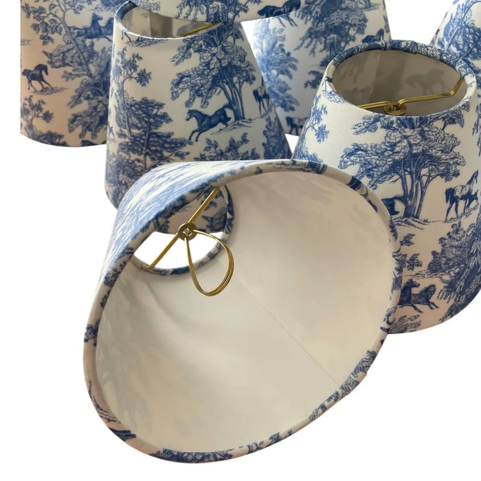 Blue Equestrian Toile Sconce Shade — underside view of grouped shades and clip fittings; Winterborne Decor