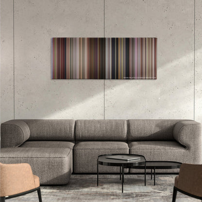13 Going on 30 color palette canvas on a concrete wall above a gray sectional sofa