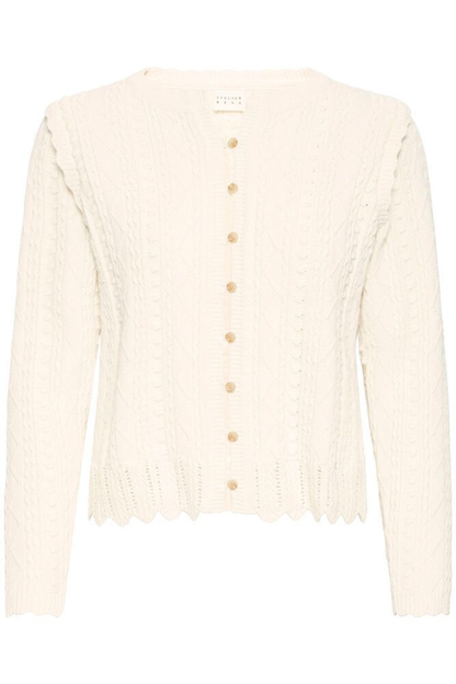 Soft cotton cardigan by Atelier Rêve in a classic birch shade. Easy to layer over dresses and tees for everyday wear. Shop at Dotique.