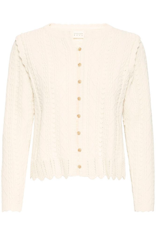 Soft cotton cardigan by Atelier Rêve in a classic birch shade. Easy to layer over dresses and tees for everyday wear. Shop at Dotique.