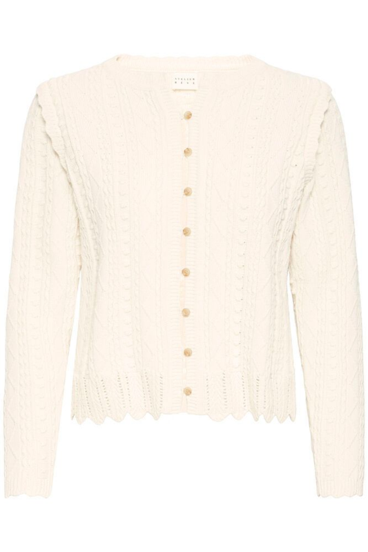 Soft cotton cardigan by Atelier Rêve in a classic birch shade. Easy to layer over dresses and tees for everyday wear. Shop at Dotique.