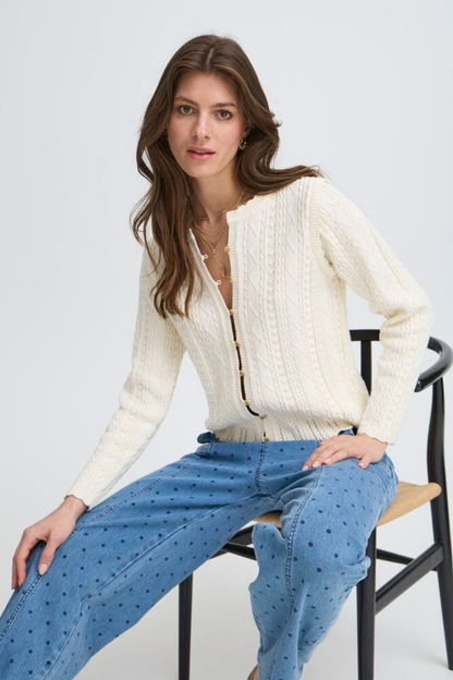 Soft cotton cardigan by Atelier Rêve in a classic birch shade. Easy to layer over dresses and tees for everyday wear. Shop at Dotique.