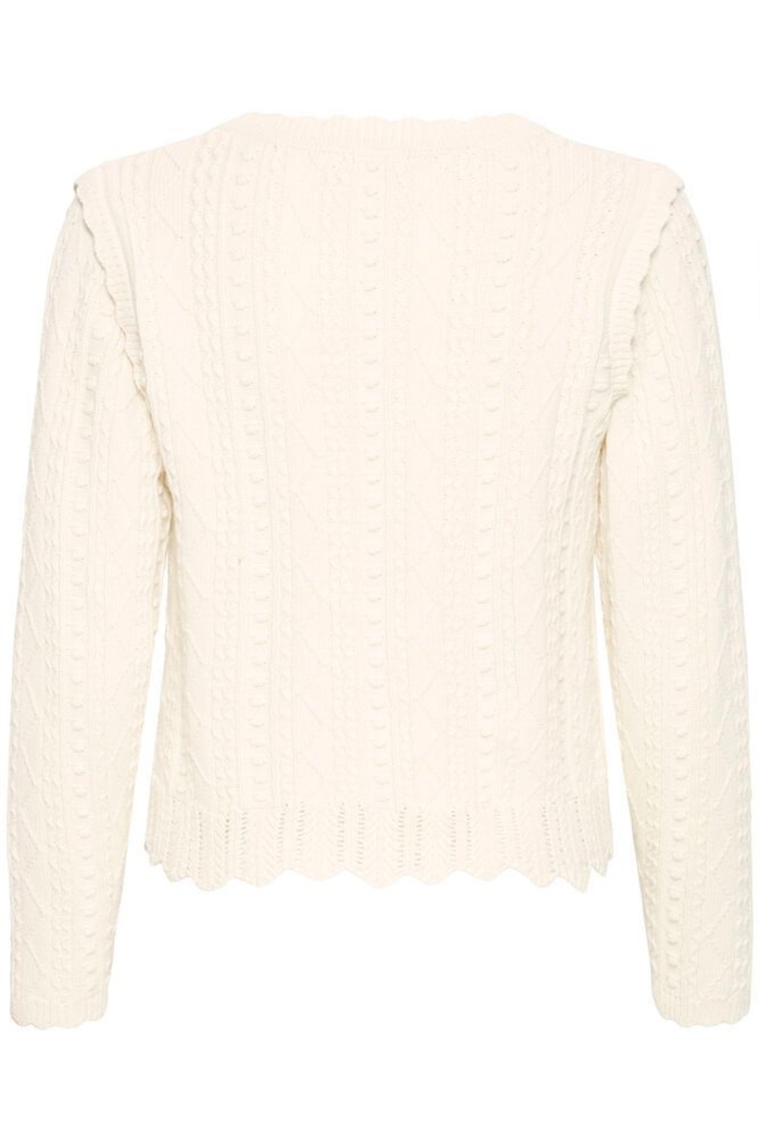 Soft cotton cardigan by Atelier Rêve in a classic birch shade. Easy to layer over dresses and tees for everyday wear. Shop at Dotique.