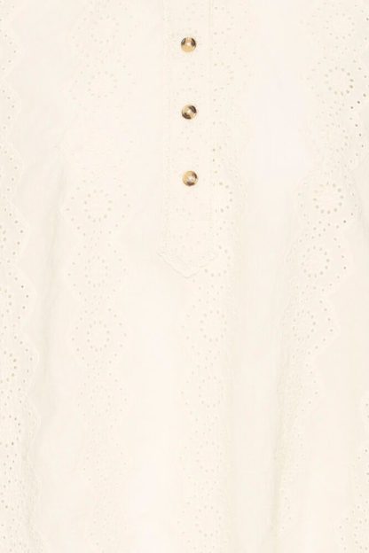 Relaxed cotton shirt by Atelier Rêve in a classic birch shade. Loose fit, long sleeves and easy everyday style. Shop at Dotique.