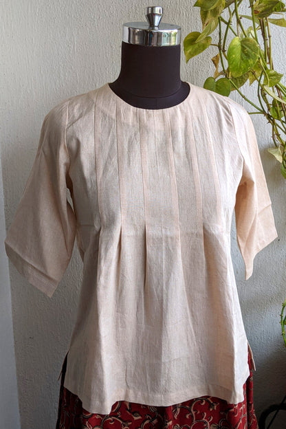 Picture of light beige top on mannequin