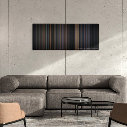 Batman color palette canvas on a concrete wall above a gray sectional sofa