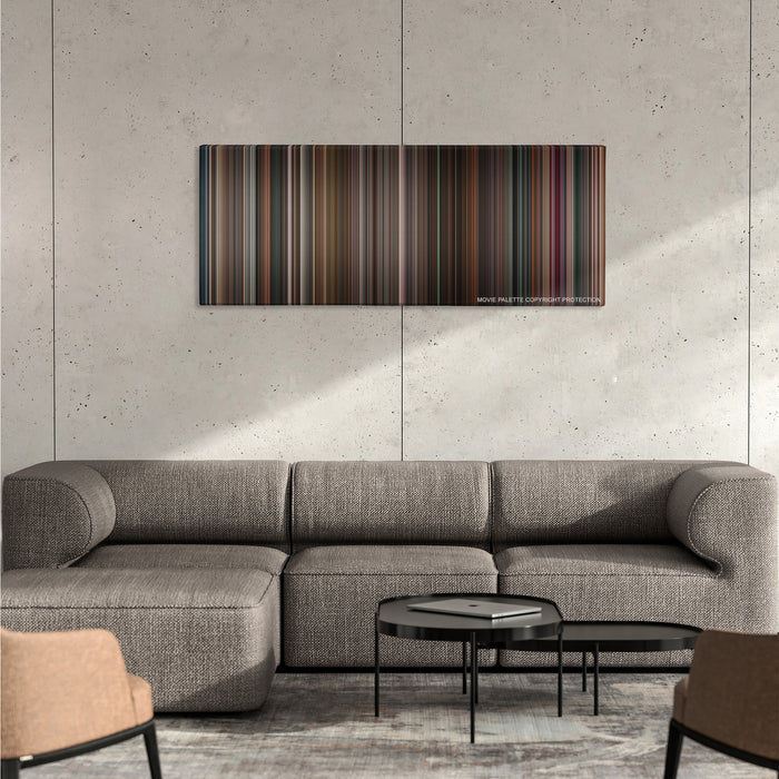 Black Swan color palette canvas on a concrete wall above a gray sectional sofa
