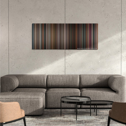 Black Swan color palette canvas on a concrete wall above a gray sectional sofa