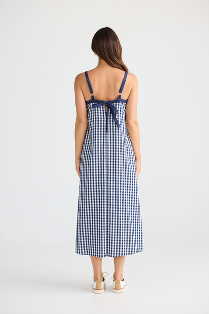 Brave + True Erica Dress in navy gingham. Cotton midi dress with shoulder straps, back tie detail and relaxed fit. Shop Brave + True at Dotique.