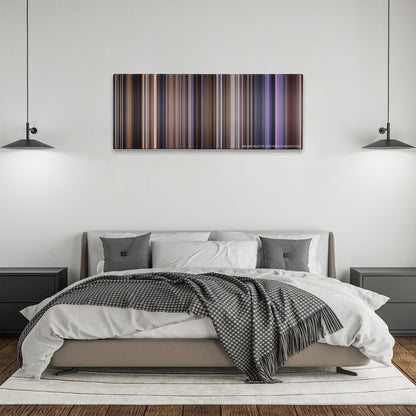 Contact color palette canvas above a bed, between two black pendant lamps