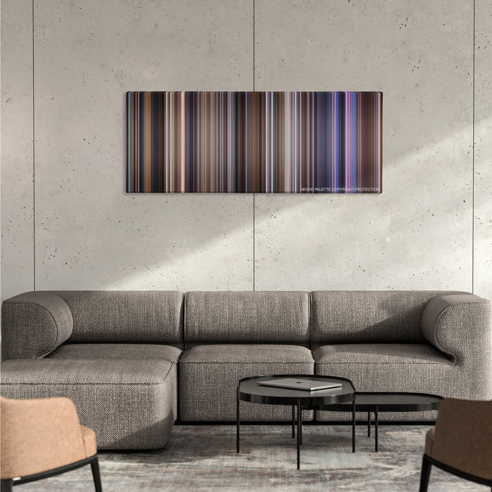 Contact color palette canvas on a concrete wall above a gray sectional sofa