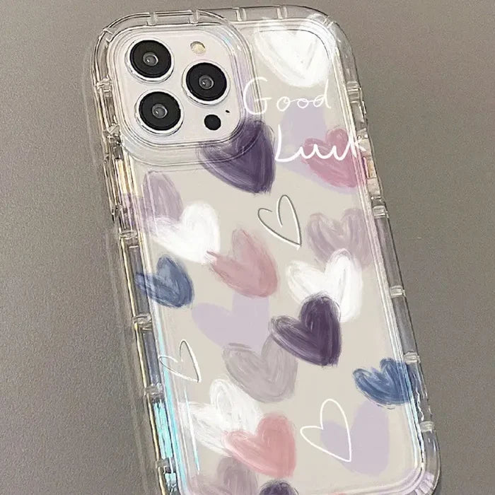 A phone case with hearts painted on it