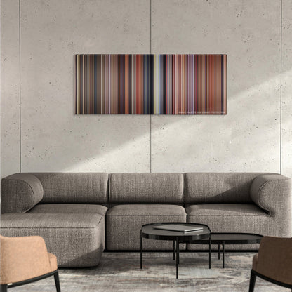 Dumb and Dumber color palette canvas on a concrete wall above a gray sectional sofa