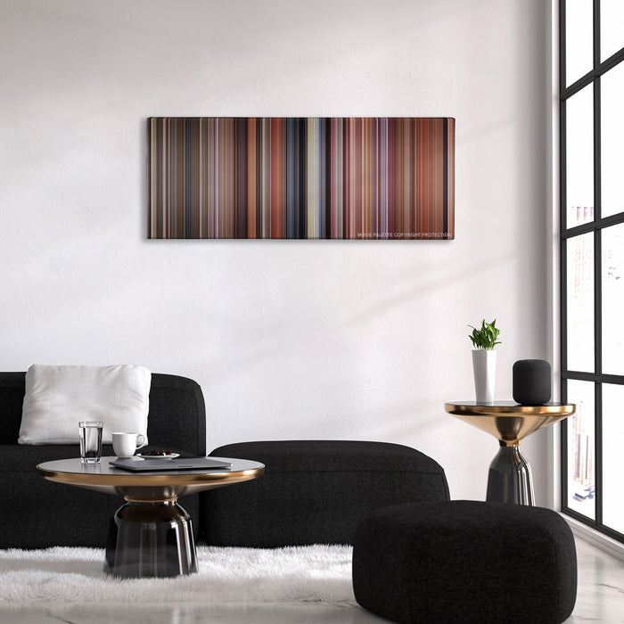 Dumb and Dumber color palette canvas above a black sofa with a gold-topped table