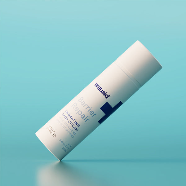 barrier repair hydrating face cream on blue background
