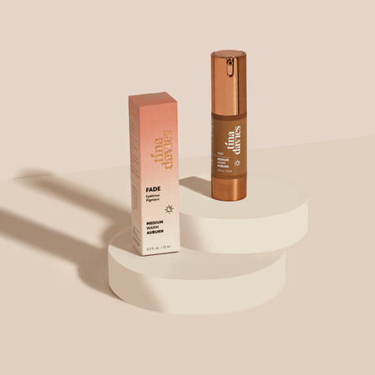 FADE Eyebrow Pigment Bottle with Box Packaging on a stand in color shade Medium Warm Auburn