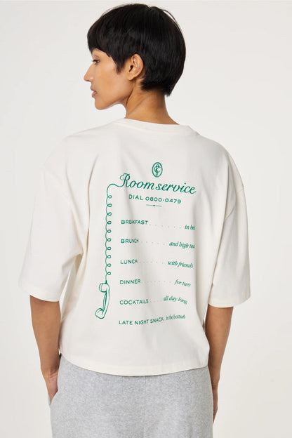 Woman wearing Fabienne Chapot Benja T-shirt Cosy White/Green with printed back text, shop Fabienne Chapot at Dotique.