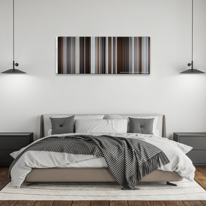 Fargo color palette canvas above a bed, between two black pendant lamps