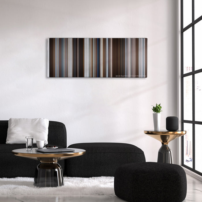 Fargo color palette canvas above a black sofa with a gold-topped table