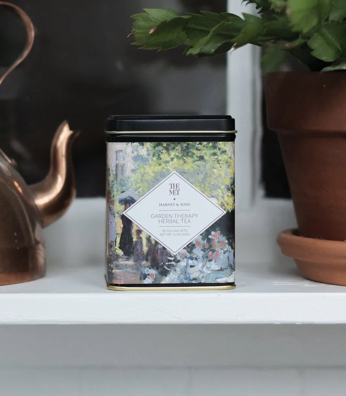 Garden Therapy Herbal Infusion by Harney & Sons — tea packaging and serving presentation; styled props are separate