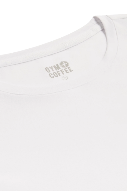 Close-up of the Gym+Coffee Daily Urban Tee in Ultra White neckline featuring the Gym+Coffee logo Shop Gym+Coffee at Dotique