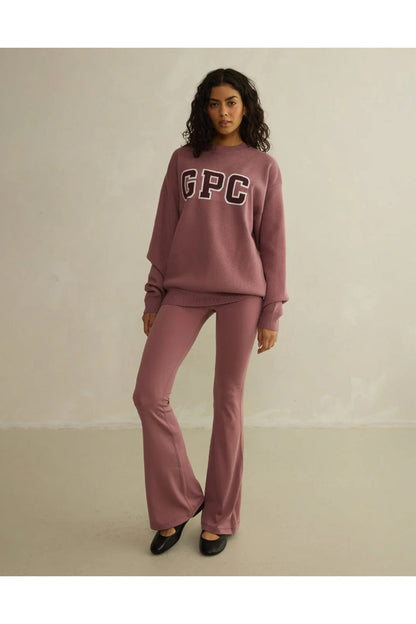 Gym+Coffee Knit Crew in Terra Rose styled on model, breathable fabric with GPC logo, shop Gym+Coffee at Dotique