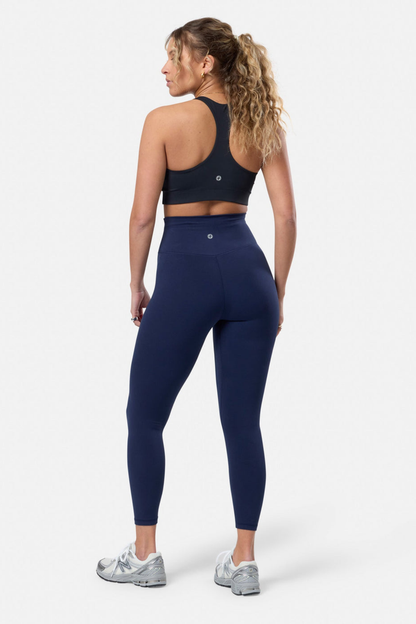 Woman wearing Gym+Coffee Womens Soft Motion Legging 7/8 Twilight Navy, shop Gym+Coffee at Dotique for comfort and style