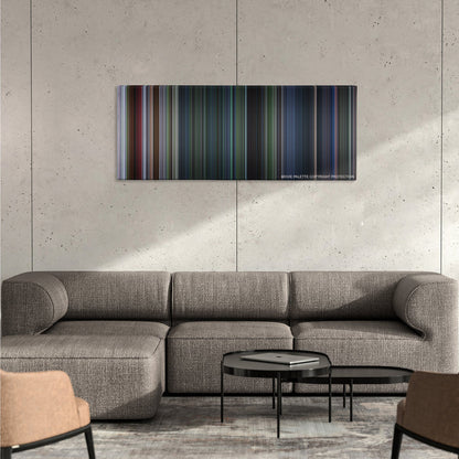 Jurassic Park III color palette canvas on a concrete wall above a gray sectional sofa