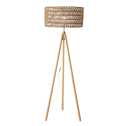 The Lexi Seagrass Natural Tripod Floor Lamp (165x45cm) features a woven rattan shade, wooden tripod base, and visible power cord with inline switch, bringing coastal-inspired lighting to your space.