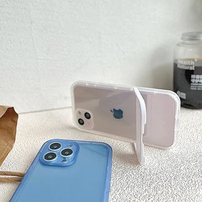 A blue iphone case sitting next to a white iphone
