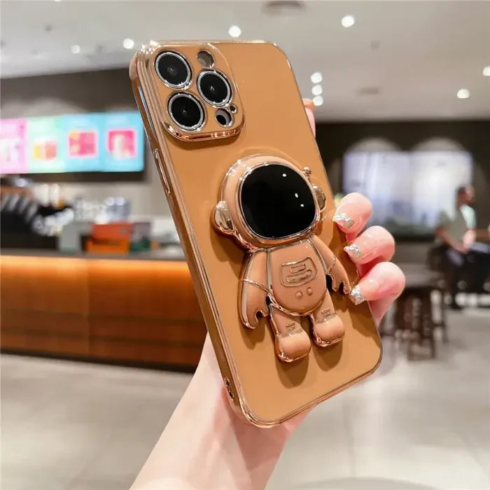 A person holding a phone case with a camera