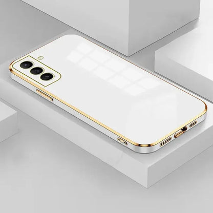 The iphone 11 is a gold case with a white back and gold sides