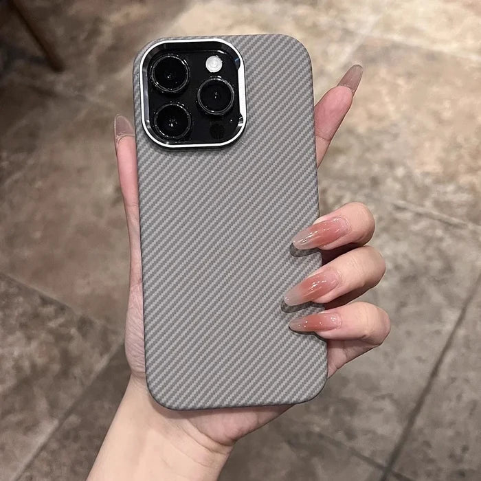 Gray carbon fiber patterned smartphone case with a silver camera bezel.