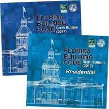 Two blue covers of the 2017 Florida Building Code Sixth Edition manuals for general and residential construction contractors