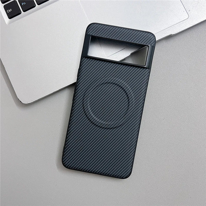 Carbon fiber textured phone case with a camera cutout and a magnetic ring.