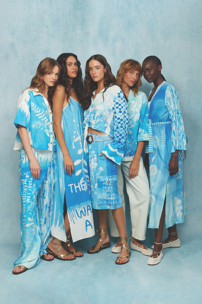 Group of models wearing blue and white outfits including Me369 Aria Cropped Indigo Linen Shirt by Me369 shop the vendor at Dotique