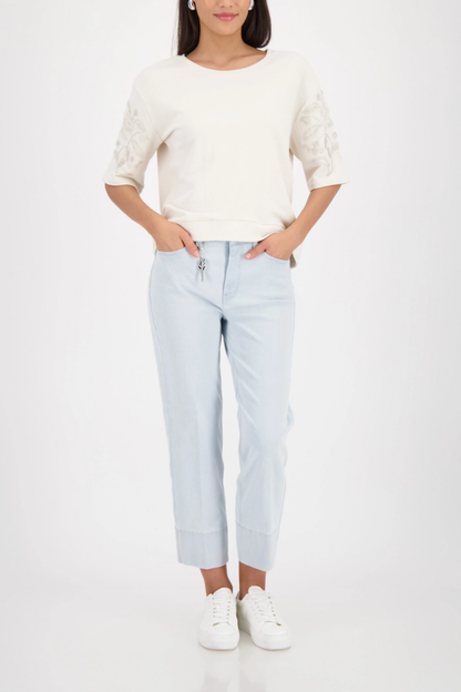 Monari 410257 Off-White Pearl Detail Cotton Sweatshirt styled with light denim jeans worn by model shop Monari at Dotique