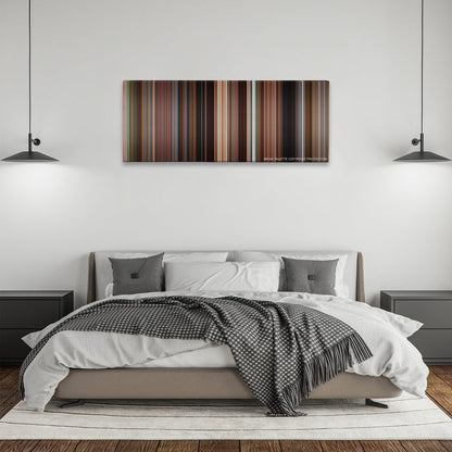 Once color palette canvas above a bed, between two black pendant lamps