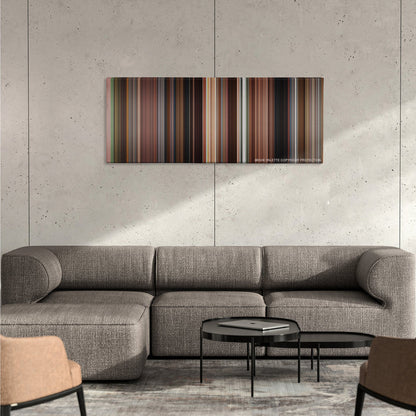 Once color palette canvas on a concrete wall above a gray sectional sofa