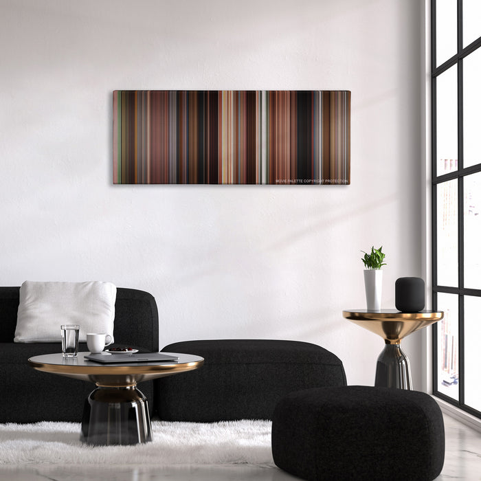 Once color palette canvas above a black sofa with a gold-topped table