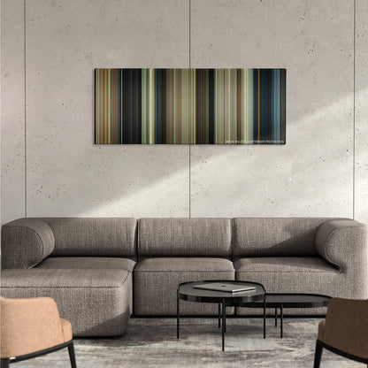 Paul color palette canvas on a concrete wall above a gray sectional sofa