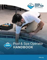 Cover of the Pool & Hot Tub Alliance’s Pool & Spa Operator Handbook featuring a man inspecting a swimming pool edge