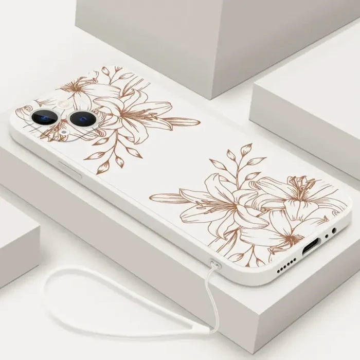 A white phone case with brown flowers on it