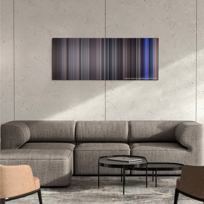 School of Rock color palette canvas on a concrete wall above a gray sectional sofa