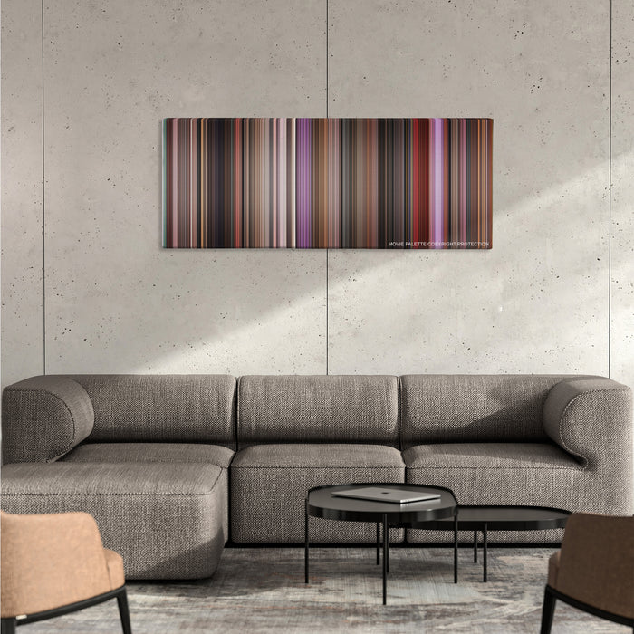 Singin' in the Rain color palette canvas on a concrete wall above a gray sectional sofa