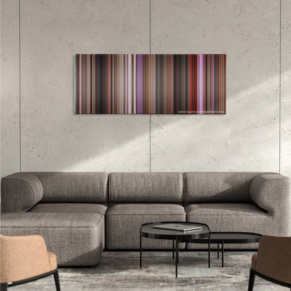 Singin' in the Rain color palette canvas on a concrete wall above a gray sectional sofa