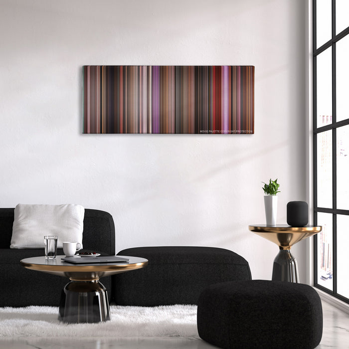 Singin' in the Rain color palette canvas above a black sofa with a gold-topped table