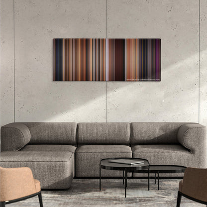 Step Up color palette canvas on a concrete wall above a gray sectional sofa