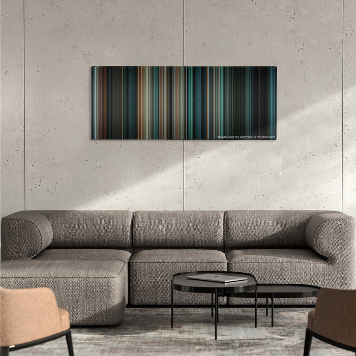 Super 8 color palette canvas on a concrete wall above a gray sectional sofa
